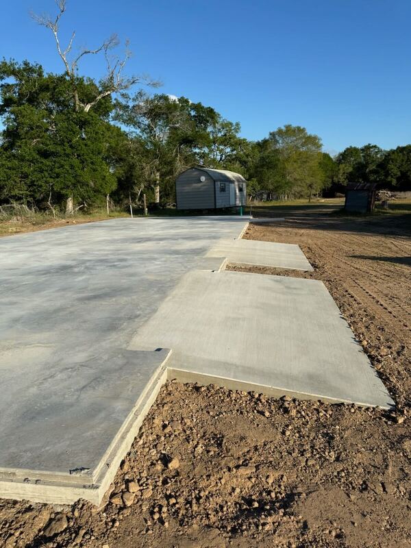 Large concrete pad with extended sections for a metal building project