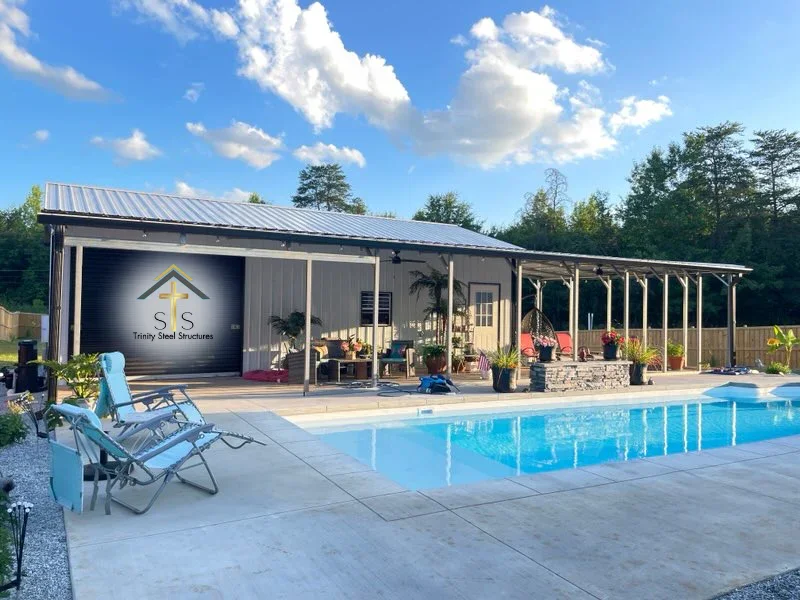Custom metal building in South Carolina with covered outdoor living space and poolside entertainment area